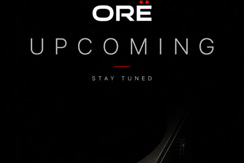 Dark background with 'ORE' logo and 'UPCOMING STAY TUNED' text
